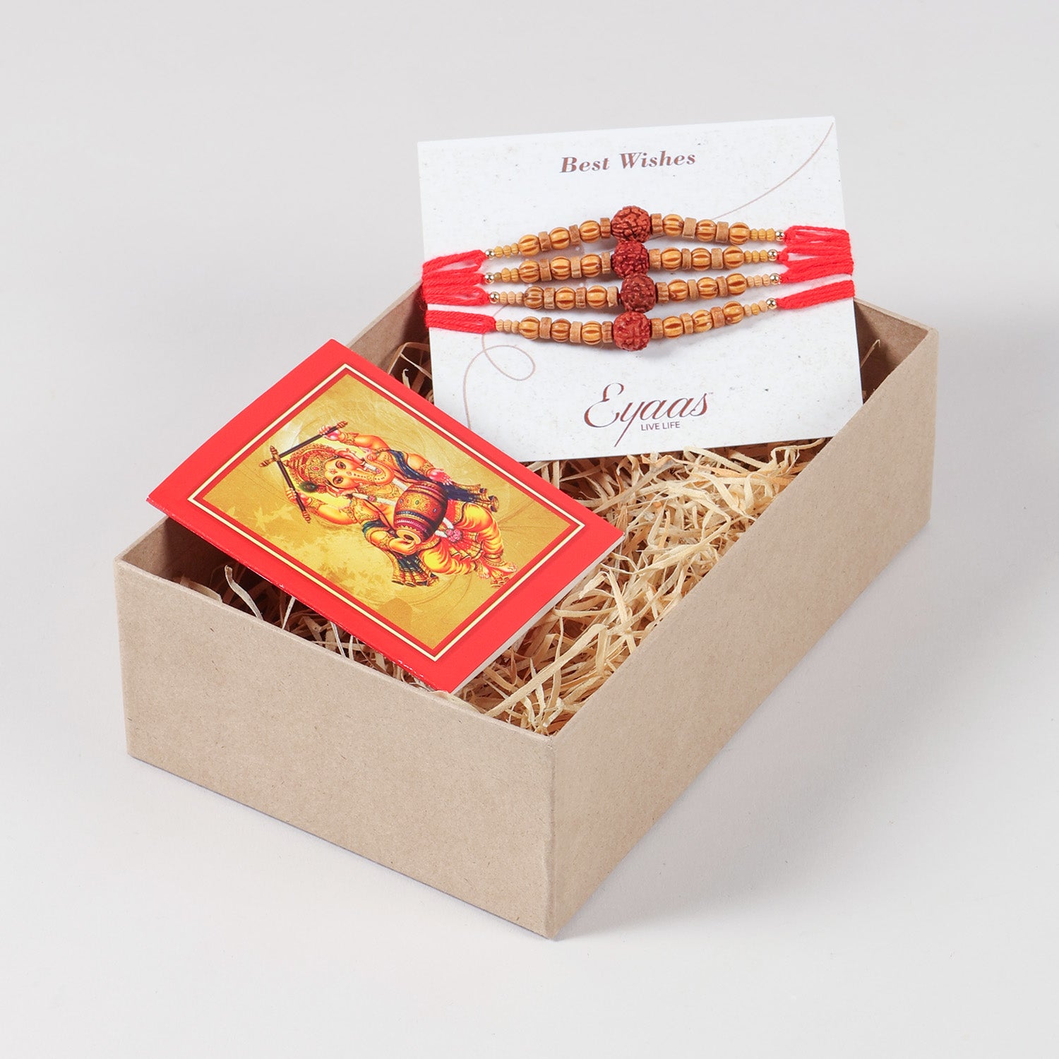 Handmade Rudraksha & Wooden Bead Rakhi Set of 4 arranged inside a decorative Raksha Bandhan gift box