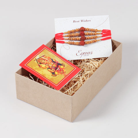 Handmade Rudraksha & Wooden Bead Rakhi Set of 4 arranged inside a decorative Raksha Bandhan gift box