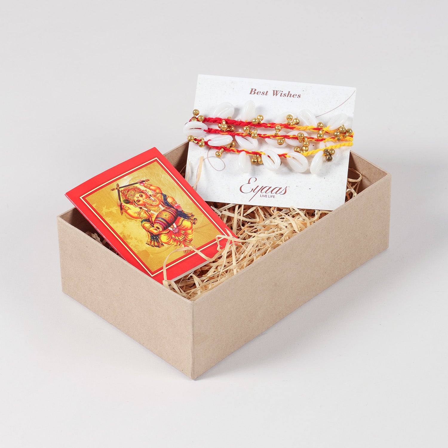 Handmade Sea Shells & Ghungroo Rakhi Set of 3 carefully arranged inside a festive Raksha Bandhan gift box