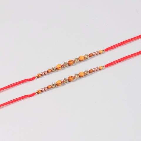 Close-up of the Handmade Wooden & Glass Beads Rakhi featuring natural wooden beads, glass beads, stone spacers, and traditional Mauli thread.