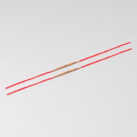 Full-length view of the Handmade Wooden & Glass Beads Rakhi Set of 2 showing handcrafted beadwork and festive Mauli thread.
