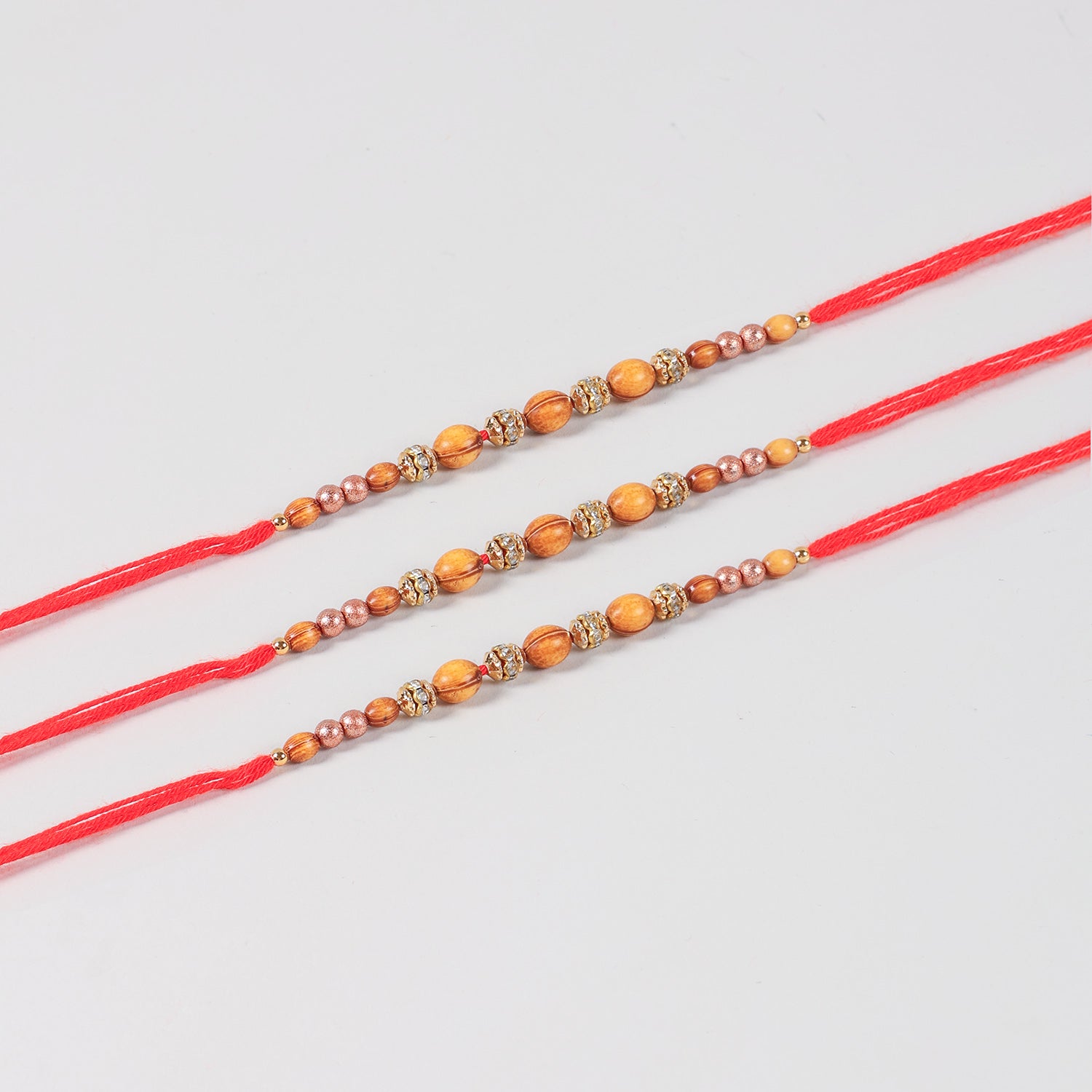 Close-up of the Handmade Wooden & Glass Beads Rakhi featuring natural wooden beads, glass beads, stone spacers, and handcrafted details