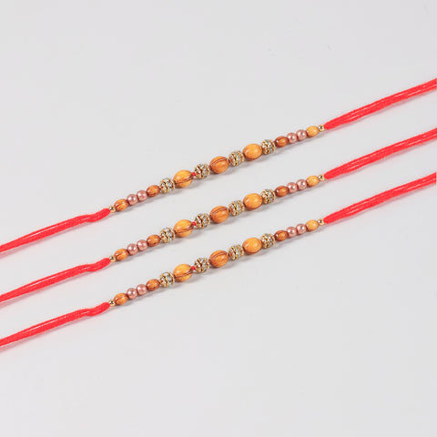 Close-up of the Handmade Wooden & Glass Beads Rakhi featuring natural wooden beads, glass beads, stone spacers, and handcrafted details