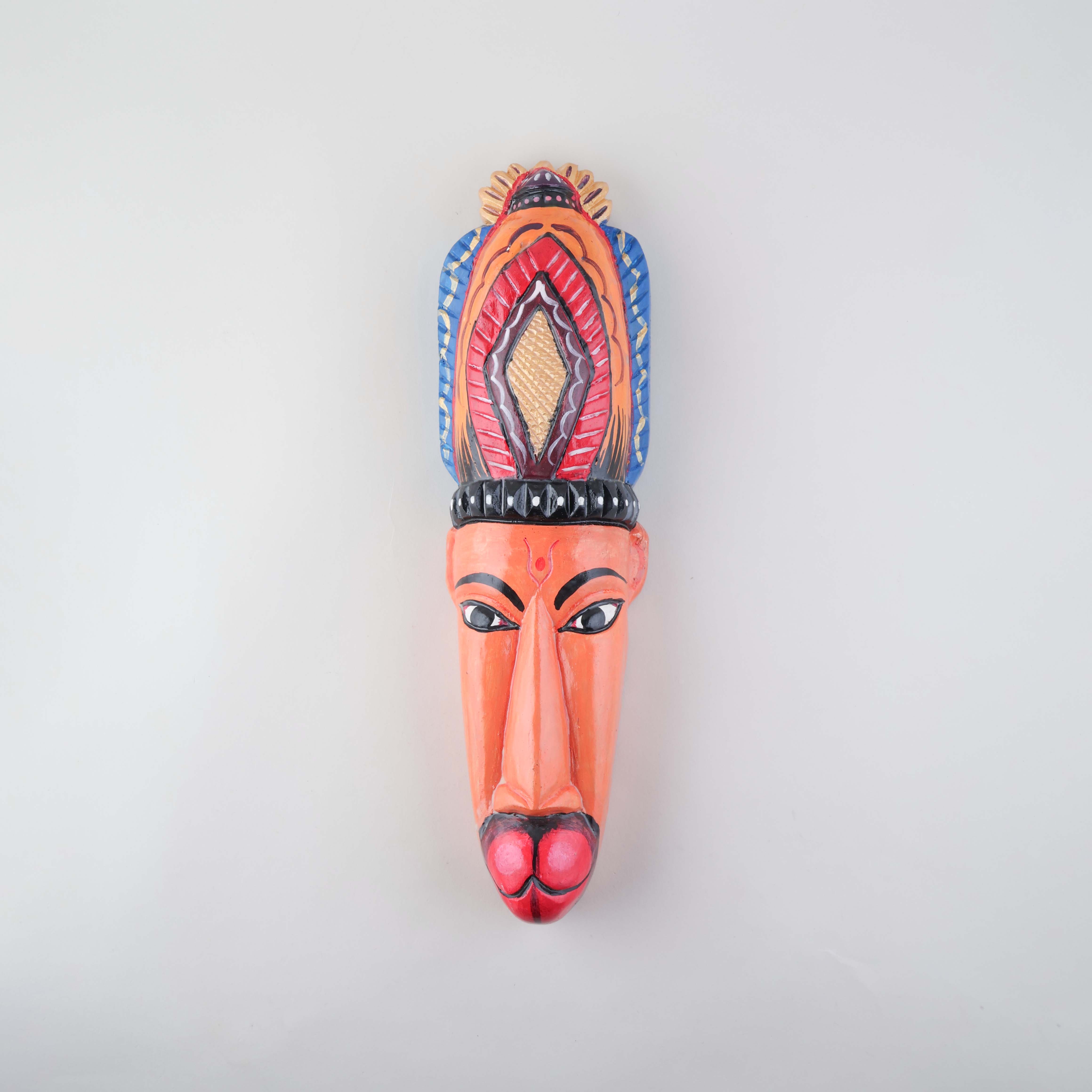 Handpainted Hanuman Gomira wooden mask featuring intricate carvings, bold colours, and traditional Indian folk art details on a plain background