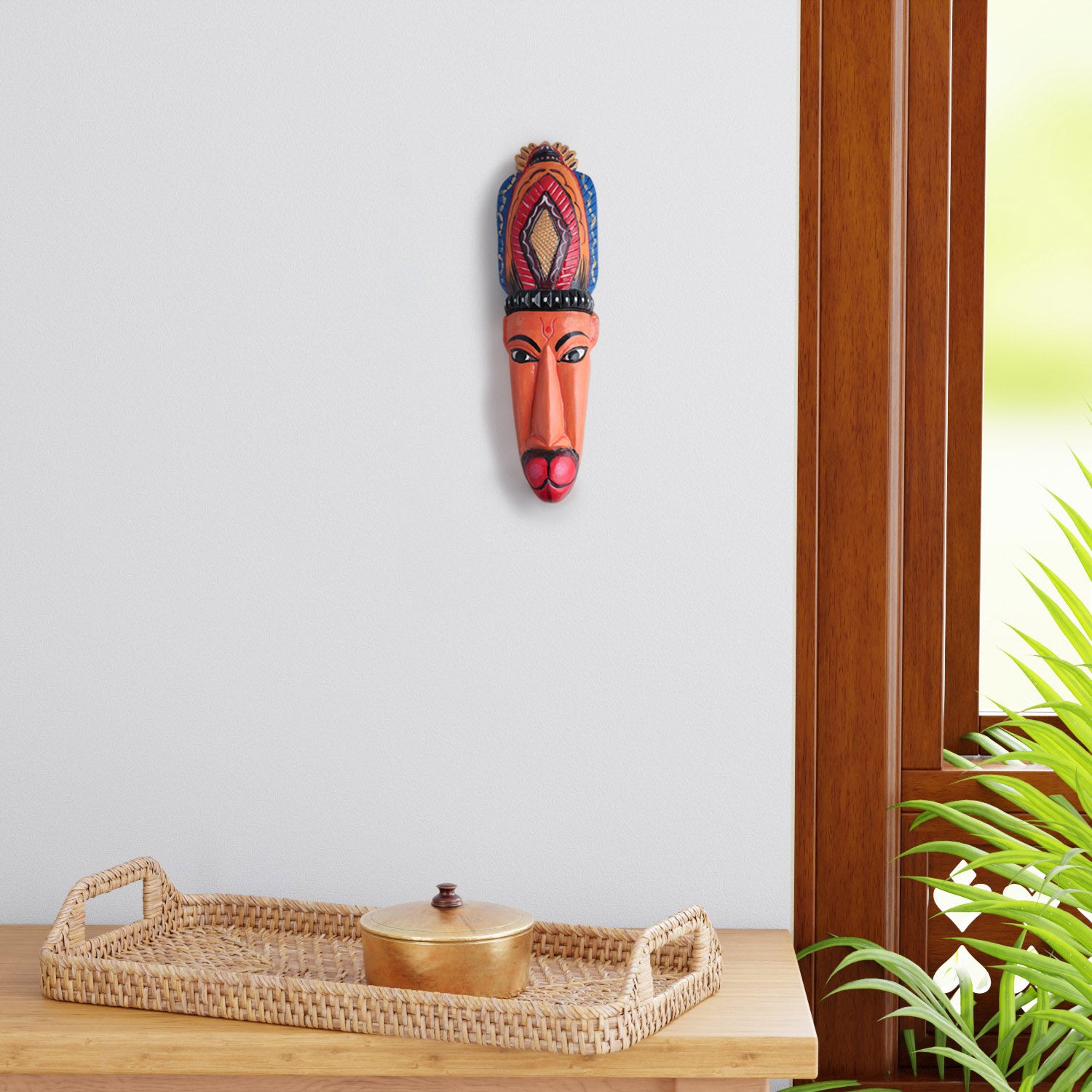 Hand-carved Hanuman Gomira wooden wall mask displayed as living room wall decor, showcasing vibrant folk art and traditional Indian craftsmanship