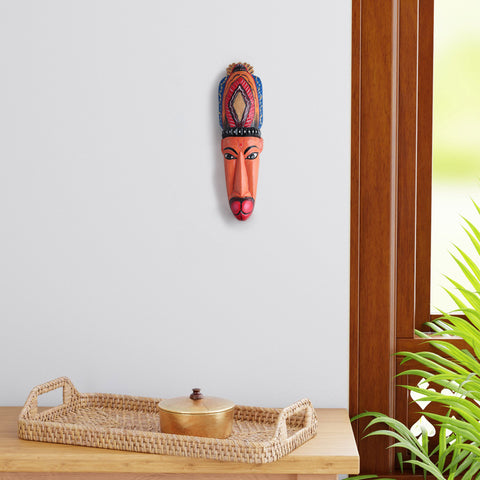 Hand-carved Hanuman Gomira wooden wall mask displayed as living room wall decor, showcasing vibrant folk art and traditional Indian craftsmanship