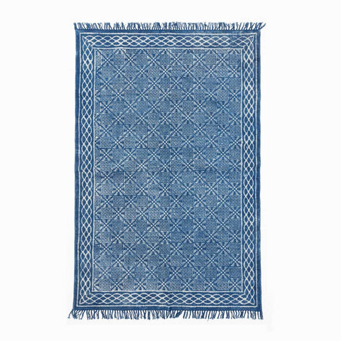 Handloom cotton dhurrie rug in indigo featuring geometric hand block printed patterns across the surface
