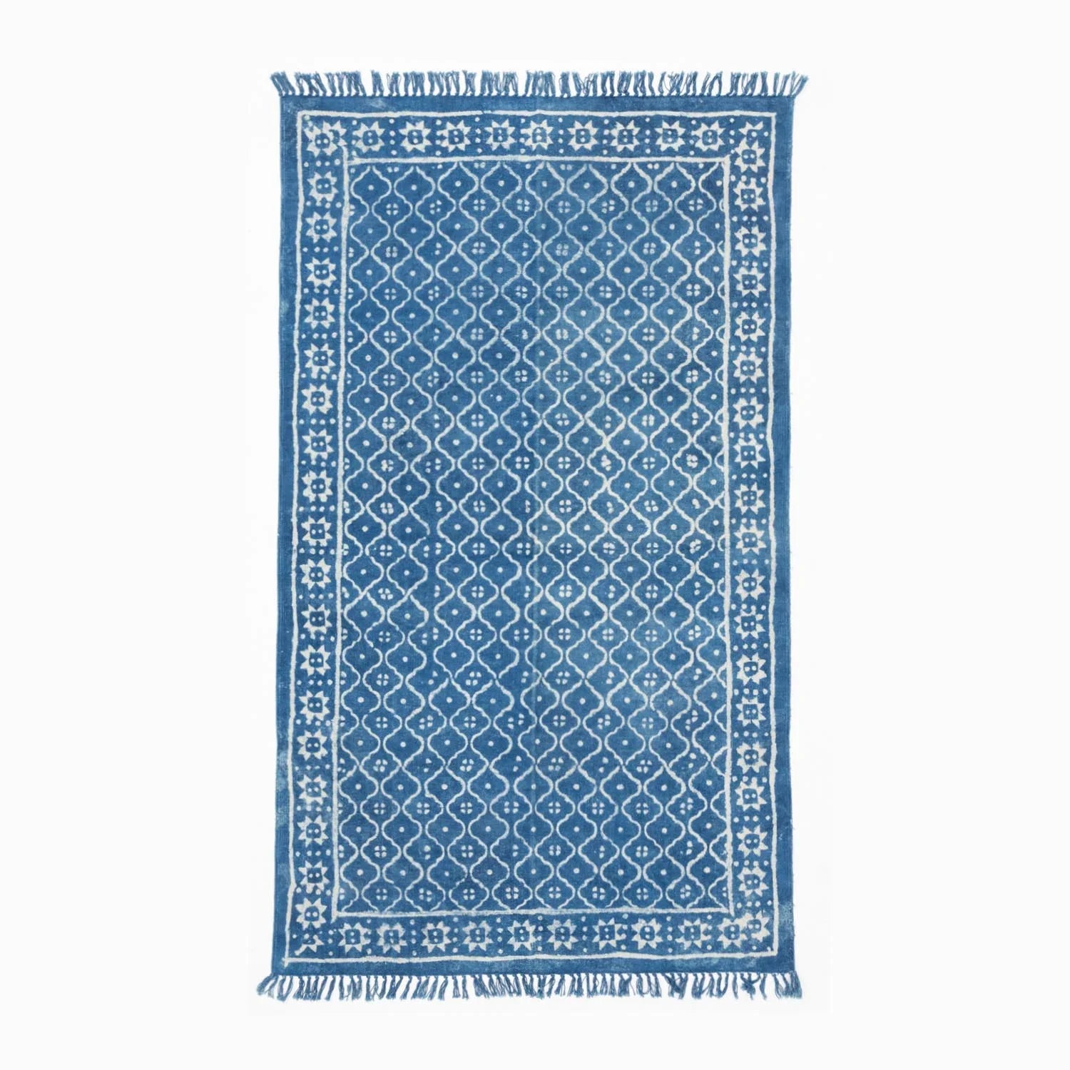 Handloom cotton dhurrie rug in indigo featuring geometric hand block printed patterns across the surface