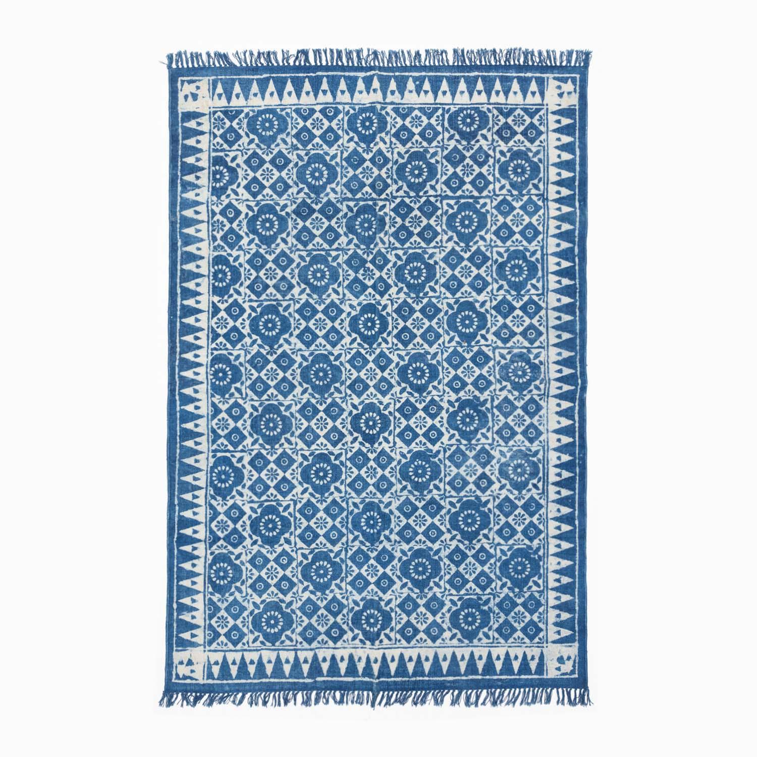 Handloom cotton dhurrie rug in indigo featuring geometric, floral hand block printed patterns across the surface