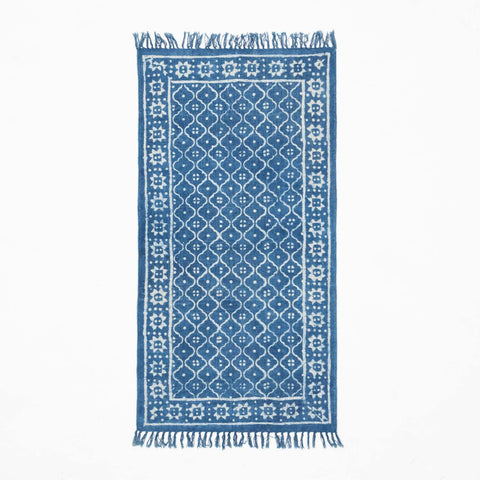 Handloom cotton dhurrie rug in indigo featuring trellis-inspired hand block printed patterns across the surface