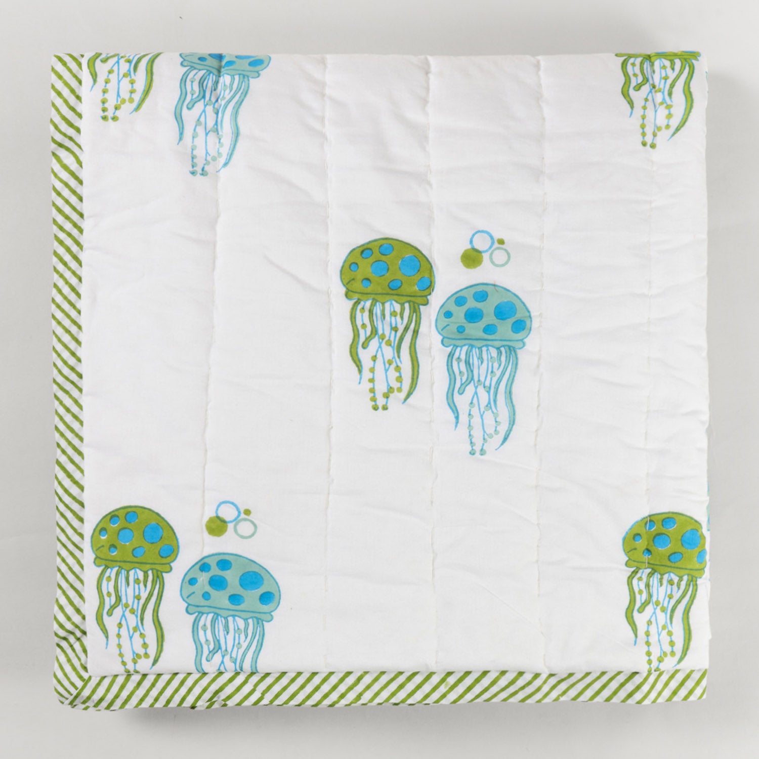  Folded reversible cotton quilt featuring hand block printed jellyfish motifs and breathable cotton construction