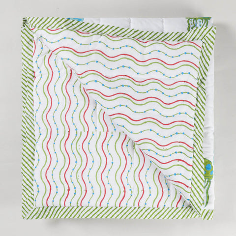 Reversible block printed cotton quilt showcasing complementary sea-inspired patterns, lightweight and suitable as an AC quilt or summer blanket