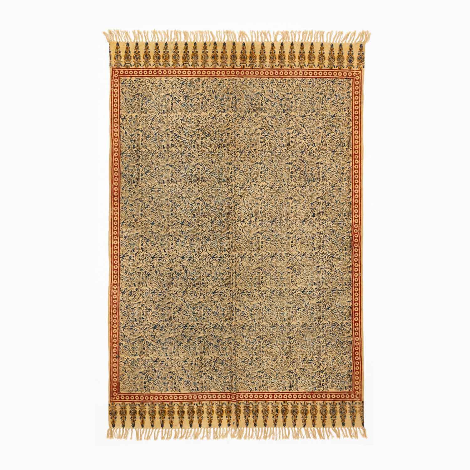 Handloom cotton dhurrie rug in mustard featuring traditional Kalamkari-inspired hand block printed patterns