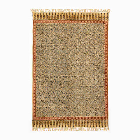 Handloom cotton dhurrie rug in mustard featuring traditional Kalamkari-inspired hand block printed patterns