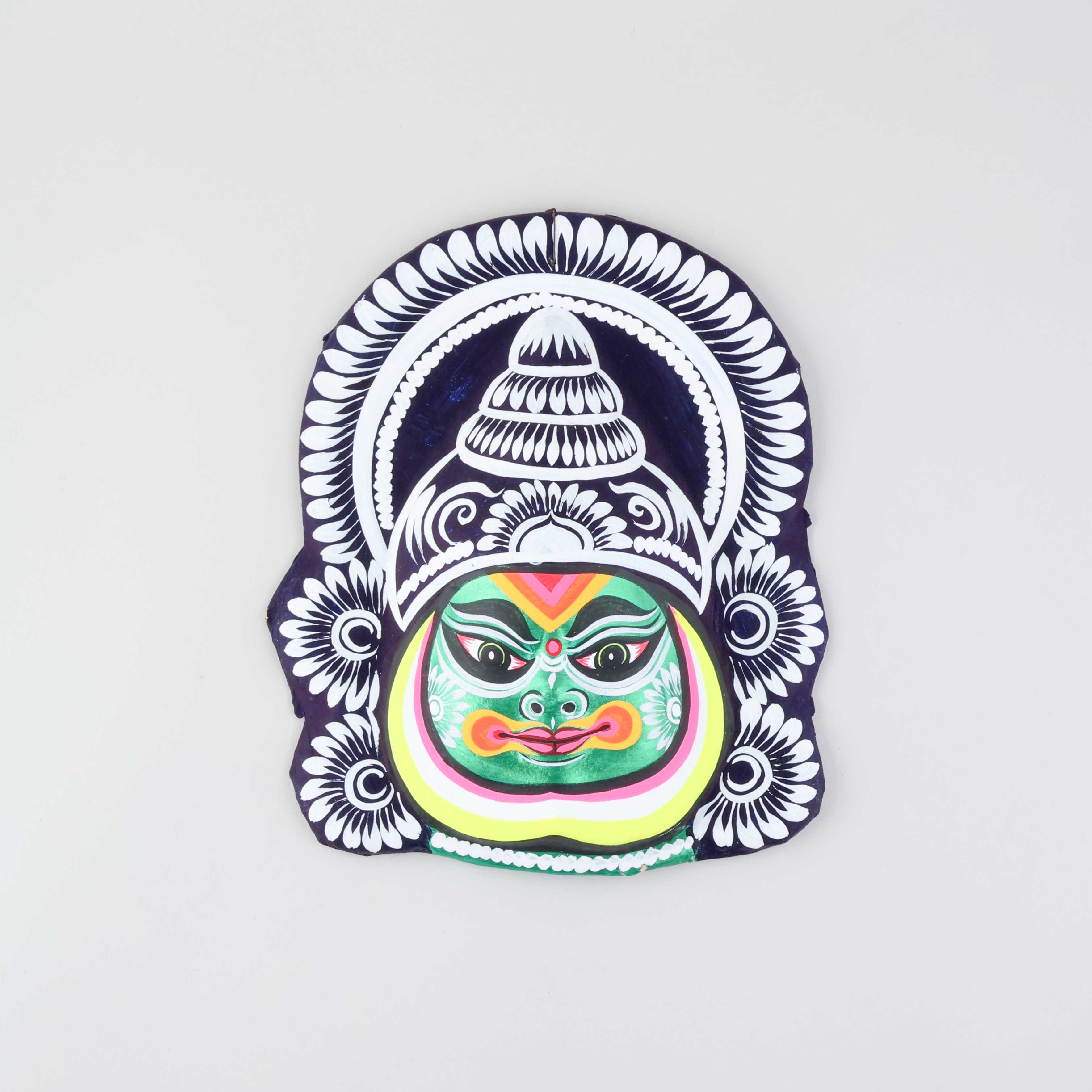 Green, orange, white, and black Kathakali Chhau wall mask handcrafted from clay, cloth, and paper, displayed on a plain background