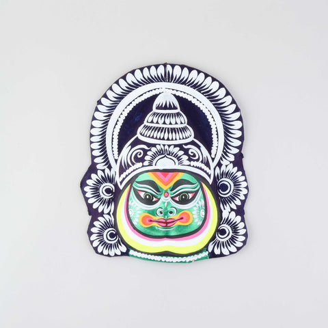 Green, orange, white, and black Kathakali Chhau wall mask handcrafted from clay, cloth, and paper, displayed on a plain background