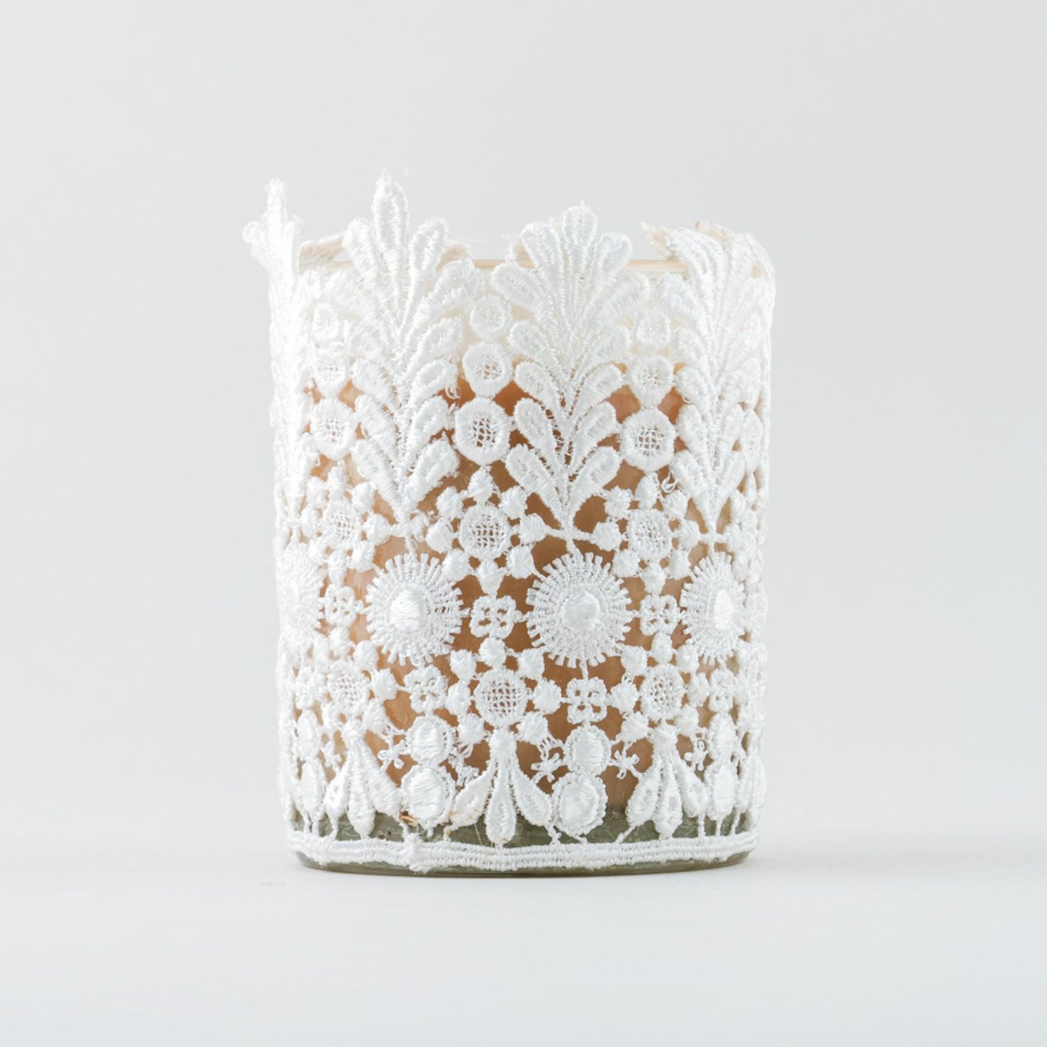 Close-up of the decorative lace glass votive surrounding the handmade Mogra soy wax candle.