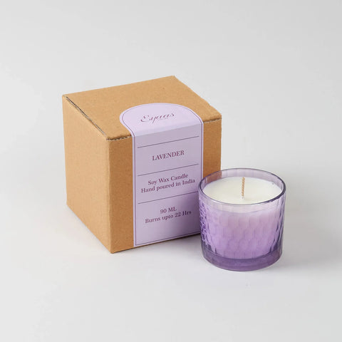 Lavender scented soy wax candle in a chiseled glass holder displayed with a decorative gift box