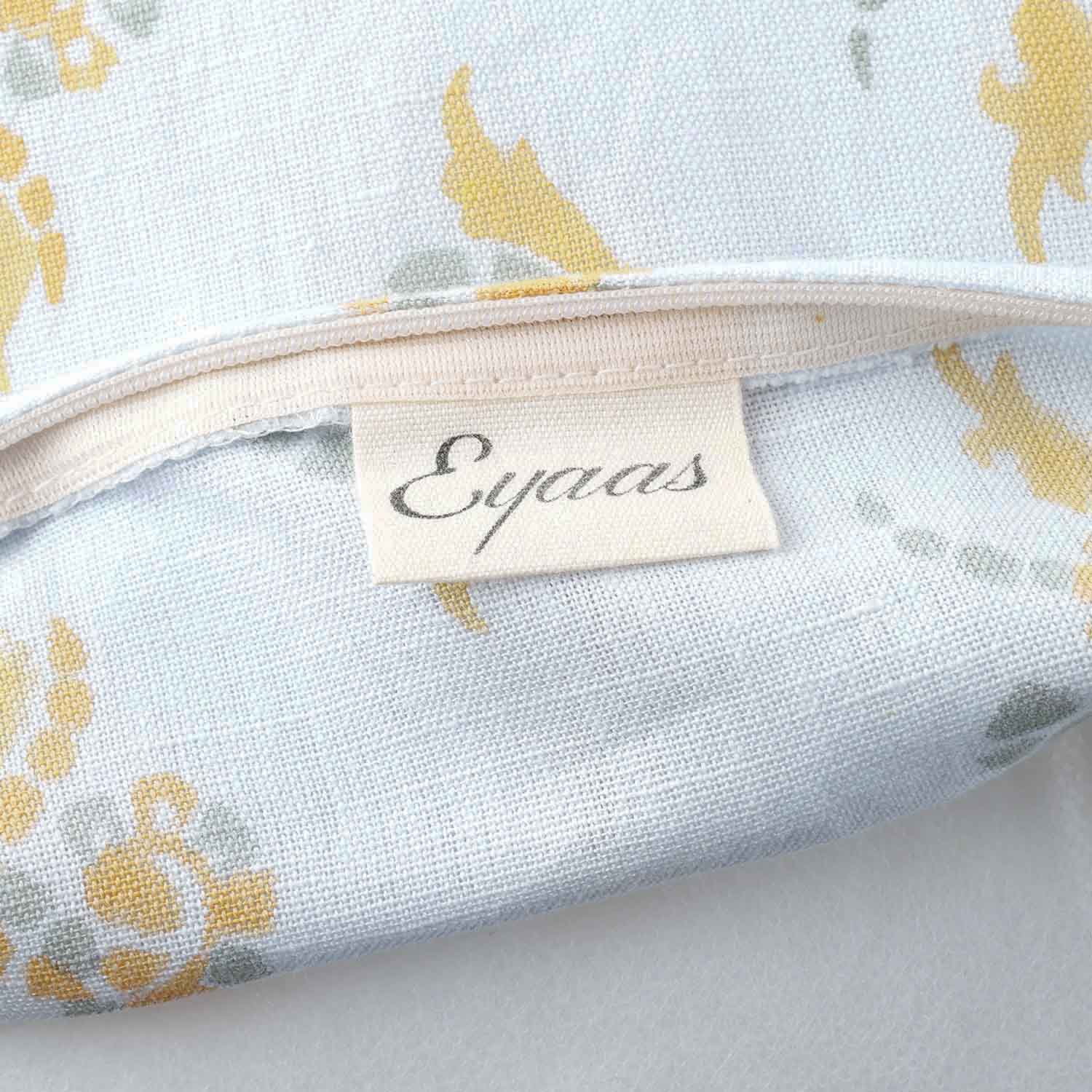 Handcrafted cotton linen cushion cover featuring some swirl motifs and a zip closure