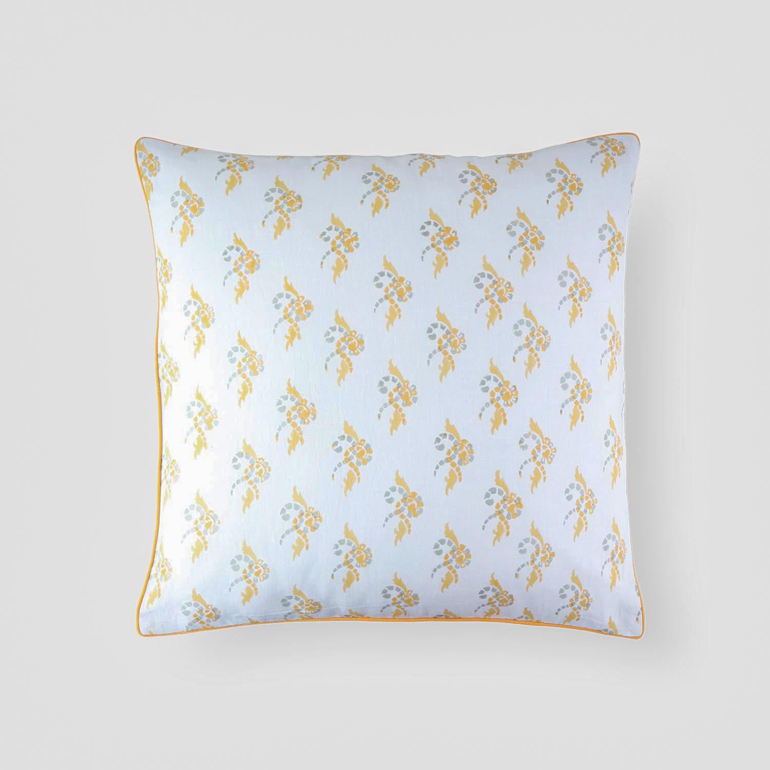 Cotton linen decorative accent pillow cover with a multicoloured swirl pattern and piped edges on a plain background