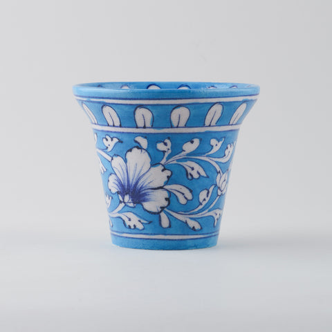 Light blue and white ceramic planter for indoor plants at eye level