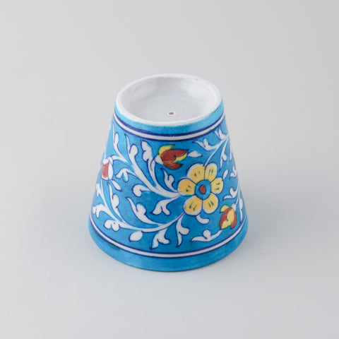 Upside down conical Blue Pottery planter showing drainage hole
