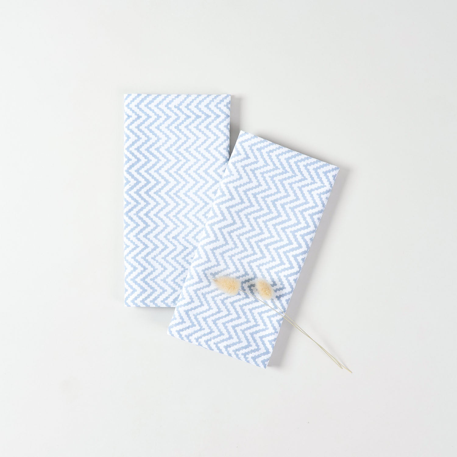 Pair of hand block-printed cotton table napkins in white and light blue for minimalist decorative styling