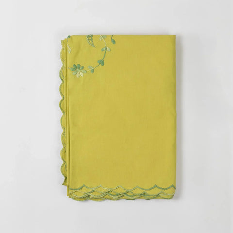 Folded light green cotton king-size bedcover showcasing floral chikankari embroidery and soft fabric texture