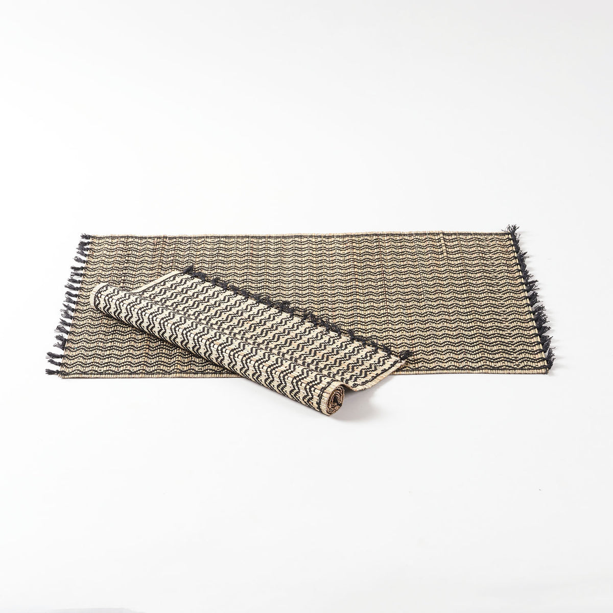 Handwoven Madhurkathi dining table placemats set crafted from natural river grass with black woven detailing