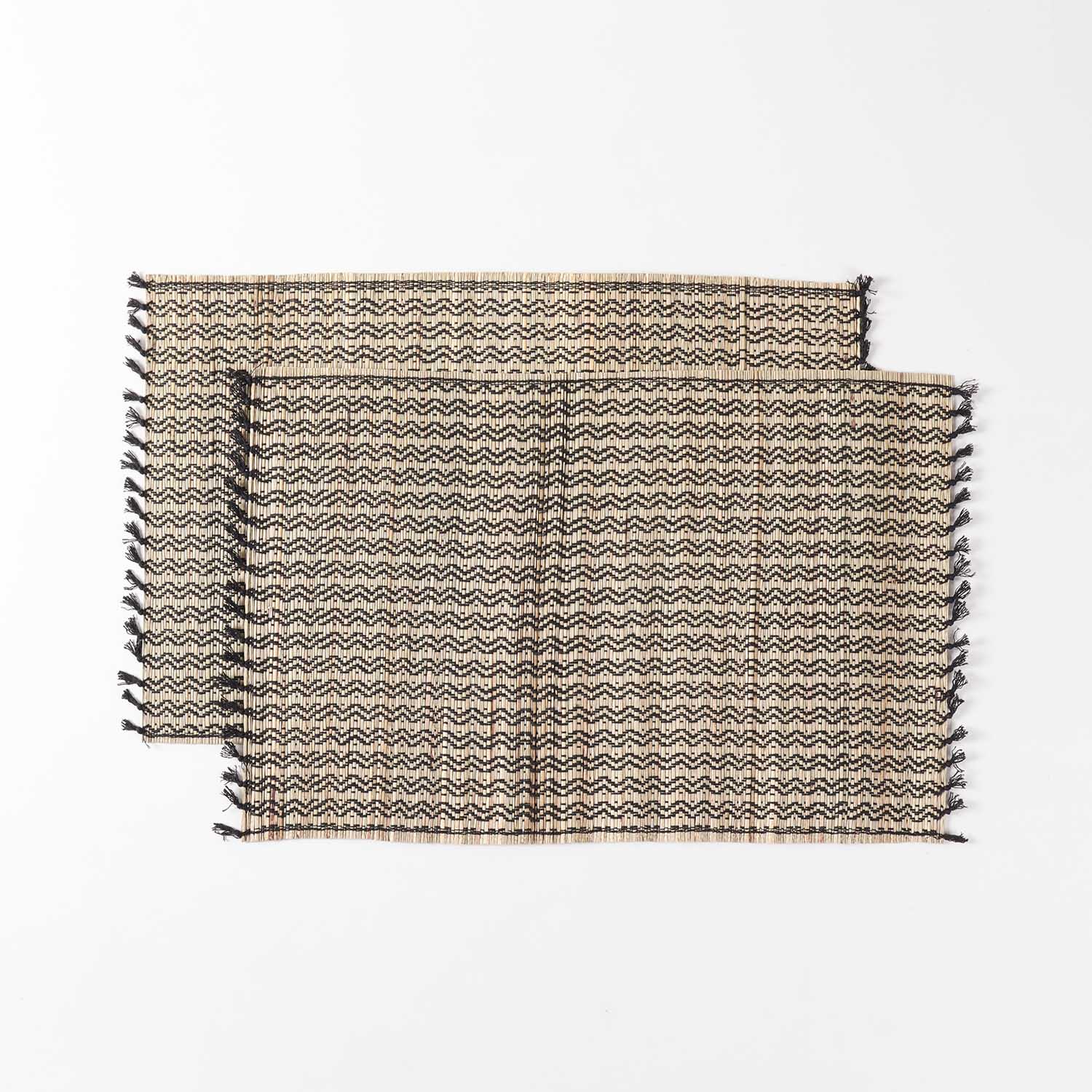 Set of 2 Madurkathi dining table placemats displayed flat, showcasing handwoven river grass texture and natural black colour combination