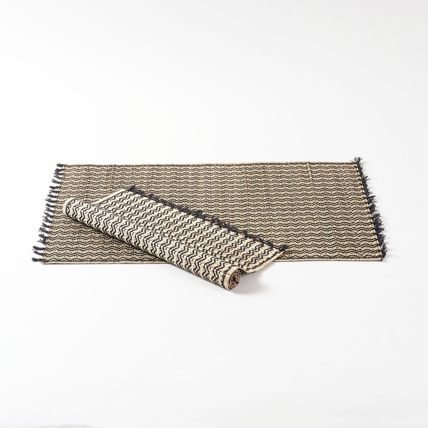 Handwoven Madurkathi dining table placemats set crafted from natural river grass with black woven detailing