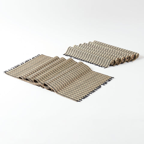 Handmade table runner and placemats set crafted from Madurkathi grass, showcasing natural fibre texture, black detailing, and fringe accents