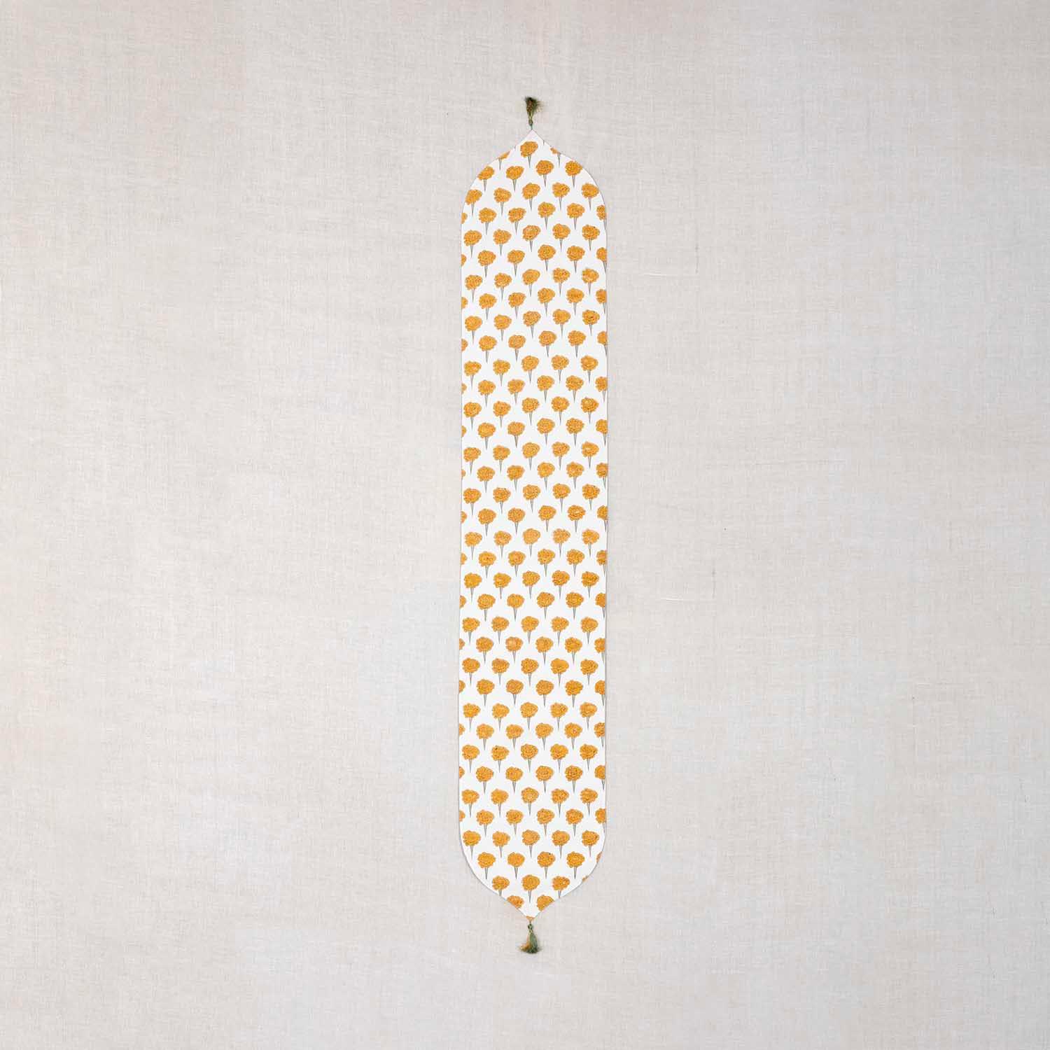 Marigold Buta block printed Chanderi table runner with yellow and green floral motifs on an off-white base
