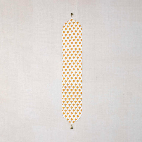 Marigold Buta block printed Chanderi table runner with yellow and green floral motifs on an off-white base