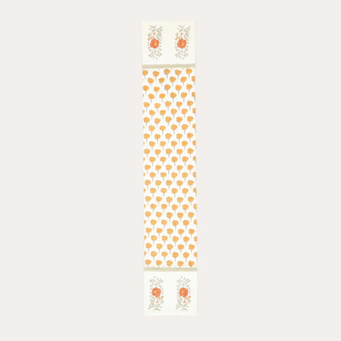 Full-size marigold buta block printed Chanderi table runner featuring traditional floral motifs on an off white base