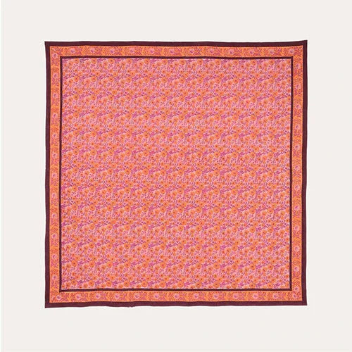 Full flat lay view of a pink cotton bedcover featuring an all-over marigold jaal block printed design
