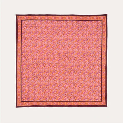 Full flat lay view of a pink cotton bedcover featuring an all-over marigold jaal block printed design