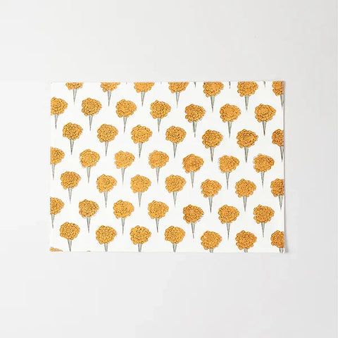 Full-size cotton placemat featuring yellow marigold floral block print design on an off white background