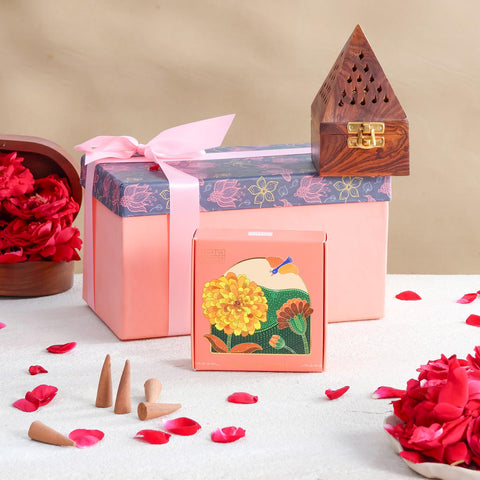 Mogra fragrance gift hamper featuring a decorative gift box, wooden incense burner, natural dhoop cones, and rose petals for festive gifting