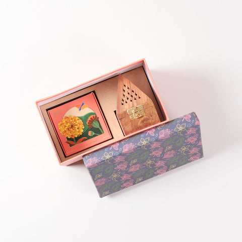 Open gift hamper showing organised packaging with natural Mogra dhoop cones and a handcrafted wooden incense holder