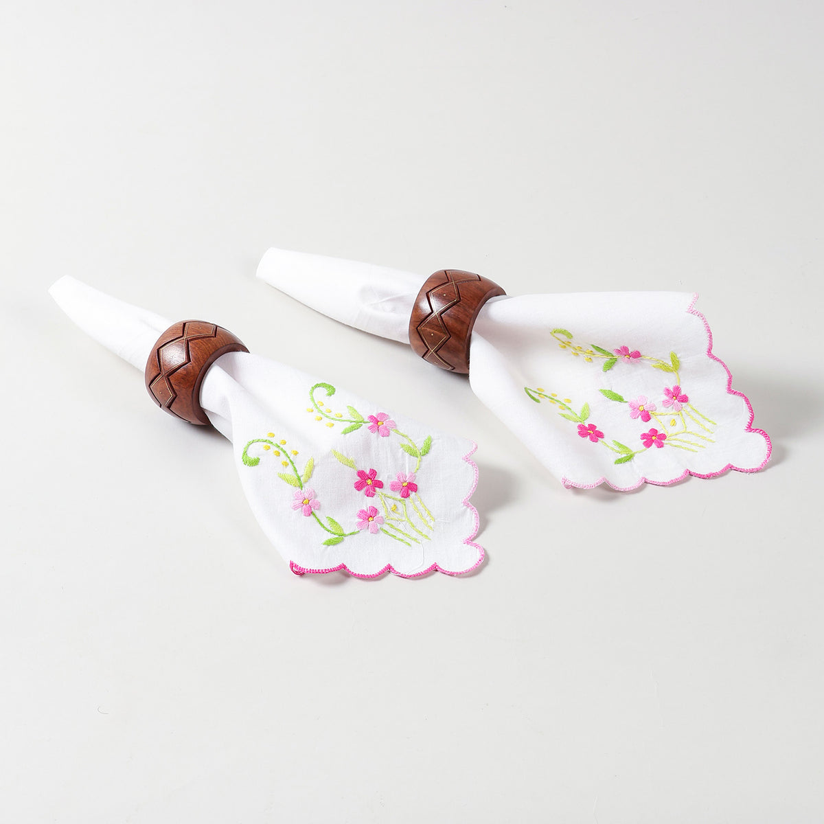 multi-colour-embroidered-napkin-set-of-2-styled.jpg
Alt Text: Set of two white cotton napkins with multicolour floral Bengal chikankari embroidery styled with napkin rings 