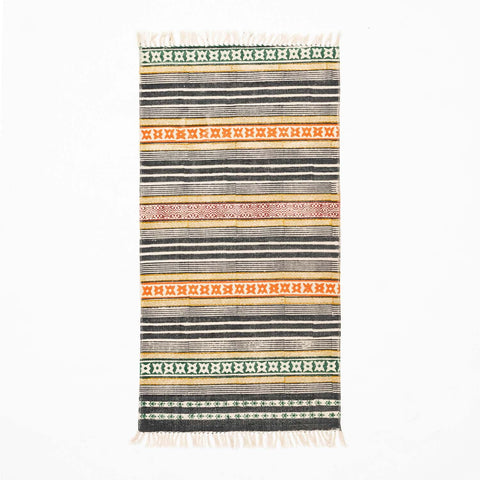 Handloom cotton dhurrie rug in multicolor featuring geometric stripe hand block printed patterns across the surface