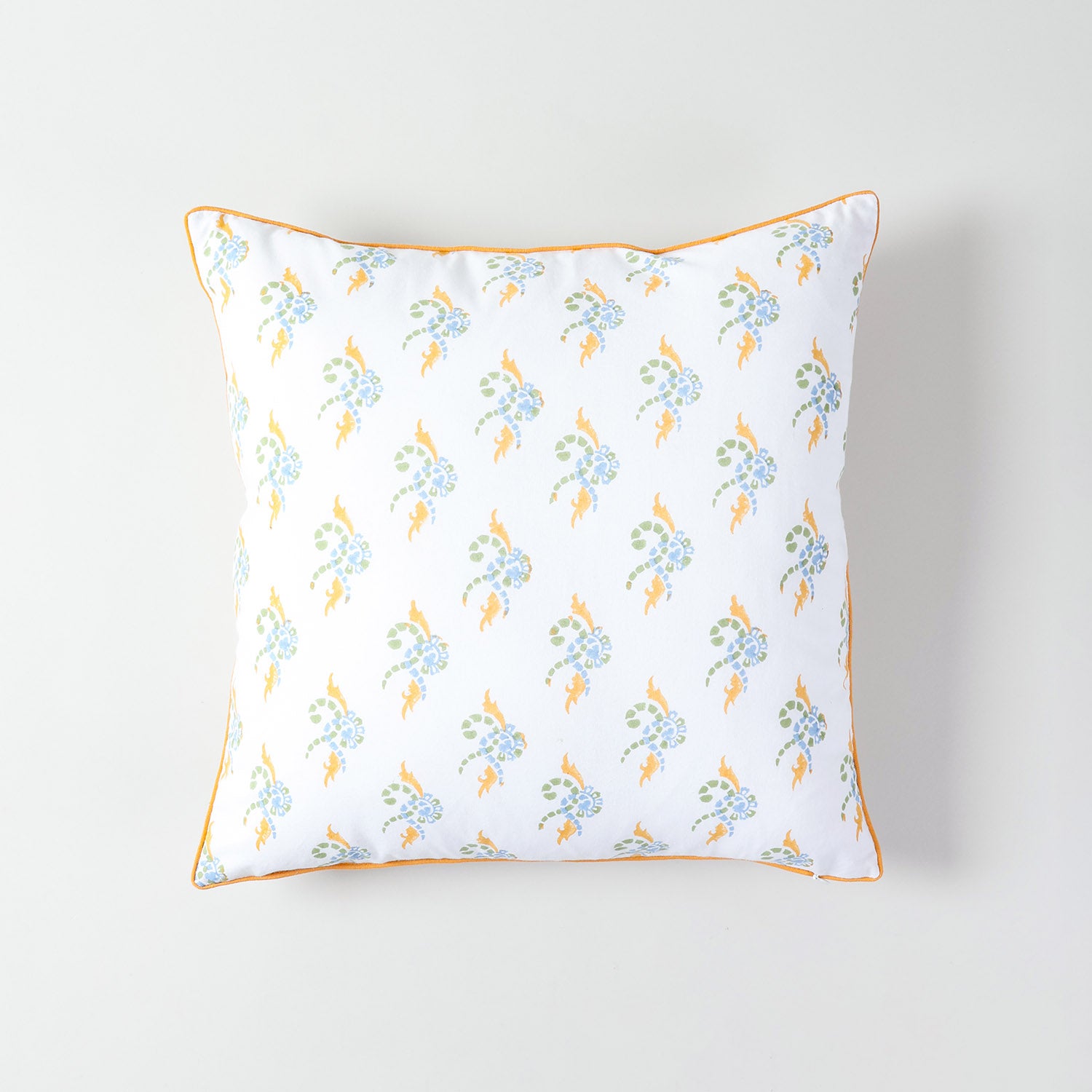  white cotton cushion cover featuring multicolored swirl patterns and a neatly piped edge