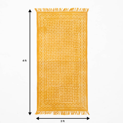 4 feet x 2 feet-sized handmade cotton rug  in mustard colour with geometric  block print design
