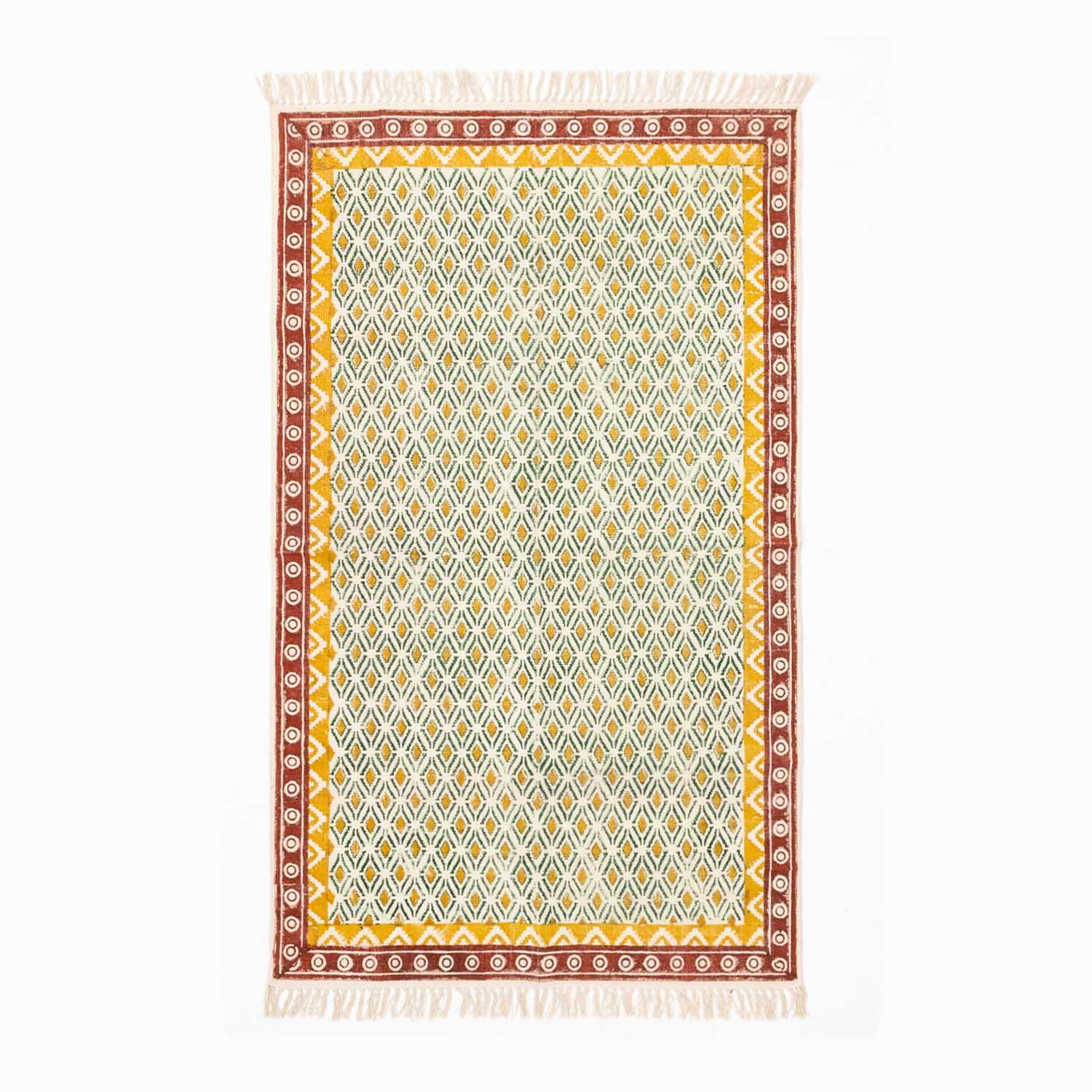 Handloom cotton dhurrie rug in mustard and red featuring geometric hand block printed patterns across the surface