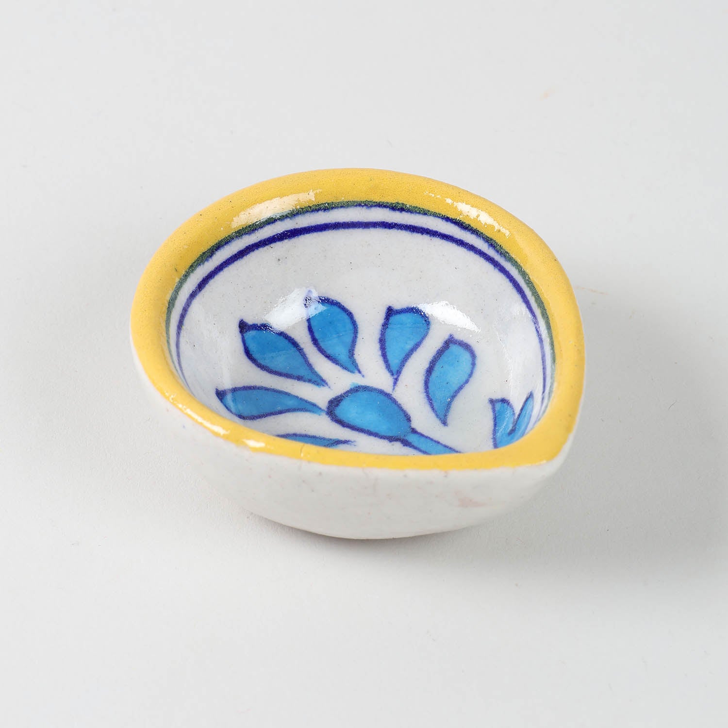 Angular view of individual handcrafted Jaipur Blue Pottery diya 