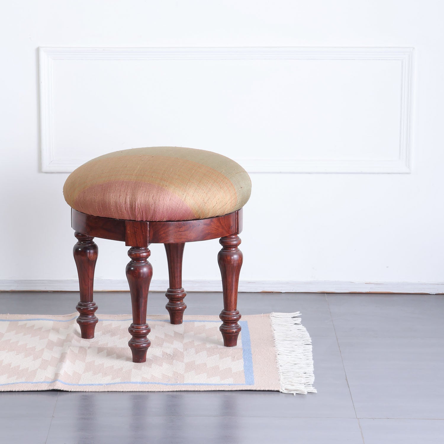 Geometric handwoven cotton dhurrie styled in a contemporary interior, adding texture and understated elegance