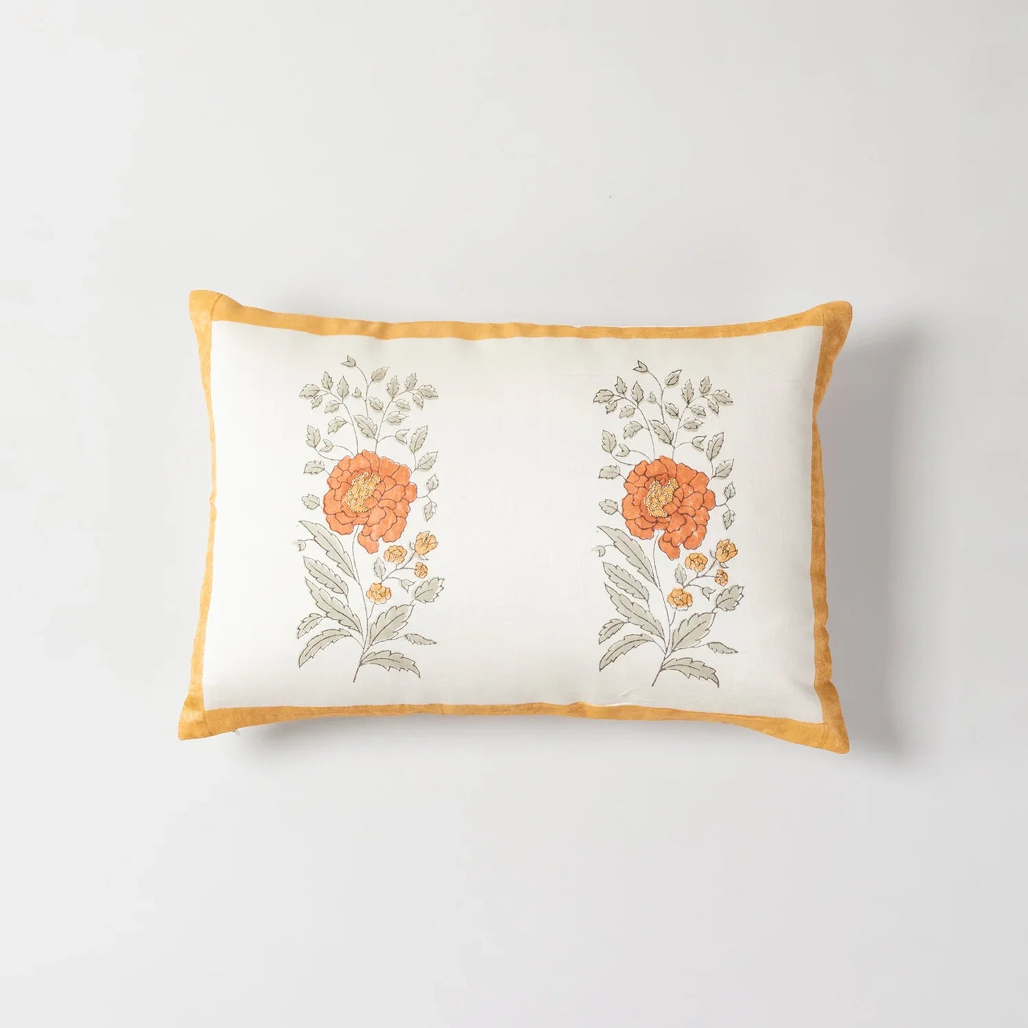 Full-size Chanderi lumbar cushion cover featuring orange marigold buta motifs and embroidered detailing