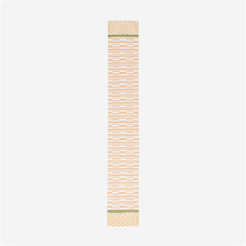 Full length table runner with orange stripe pattern green borders and handcrafted block printed detailing