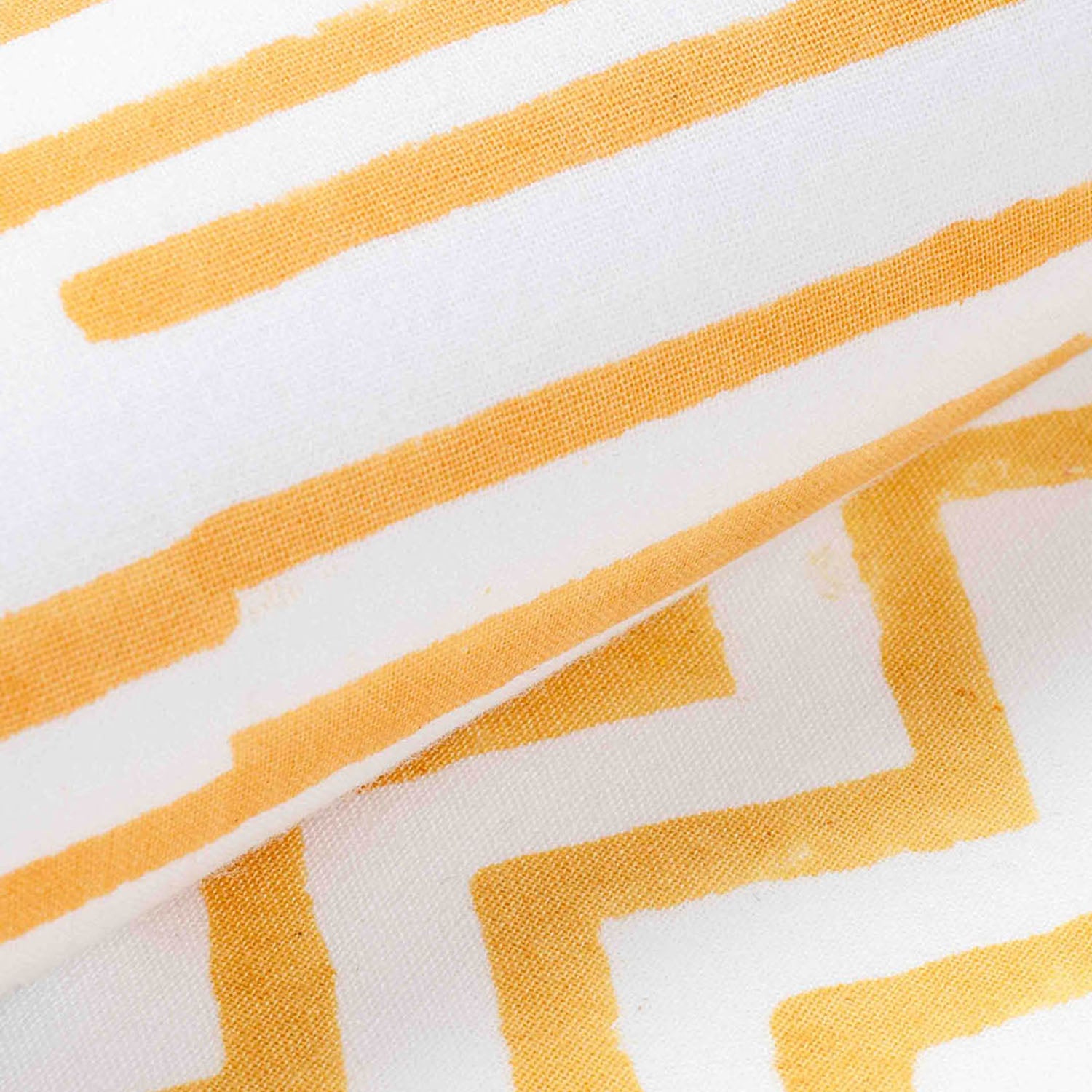 Macro view highlighting hand block printed stripe pattern fabric texture and artisan craftsmanship